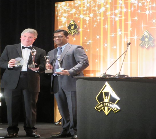 Vetri Selvan, CEO RheinBrücke IT Consulting receives the International Business Stevie Awards from Michael Gallagher